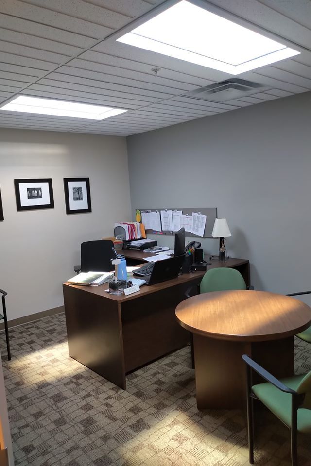Two artificial skylights above an office desk