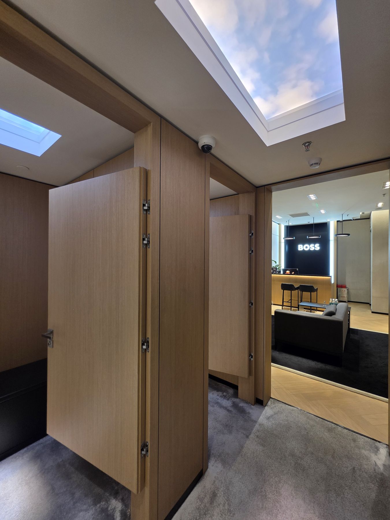 1200x600mm artificial skylight installed in a premium fashion retail fit-out, used to bring bright, even daylight into a deep-plan store floor with no natural light access, helping merchandise and finishes read true to colour under a calm, daylight-quality glow.