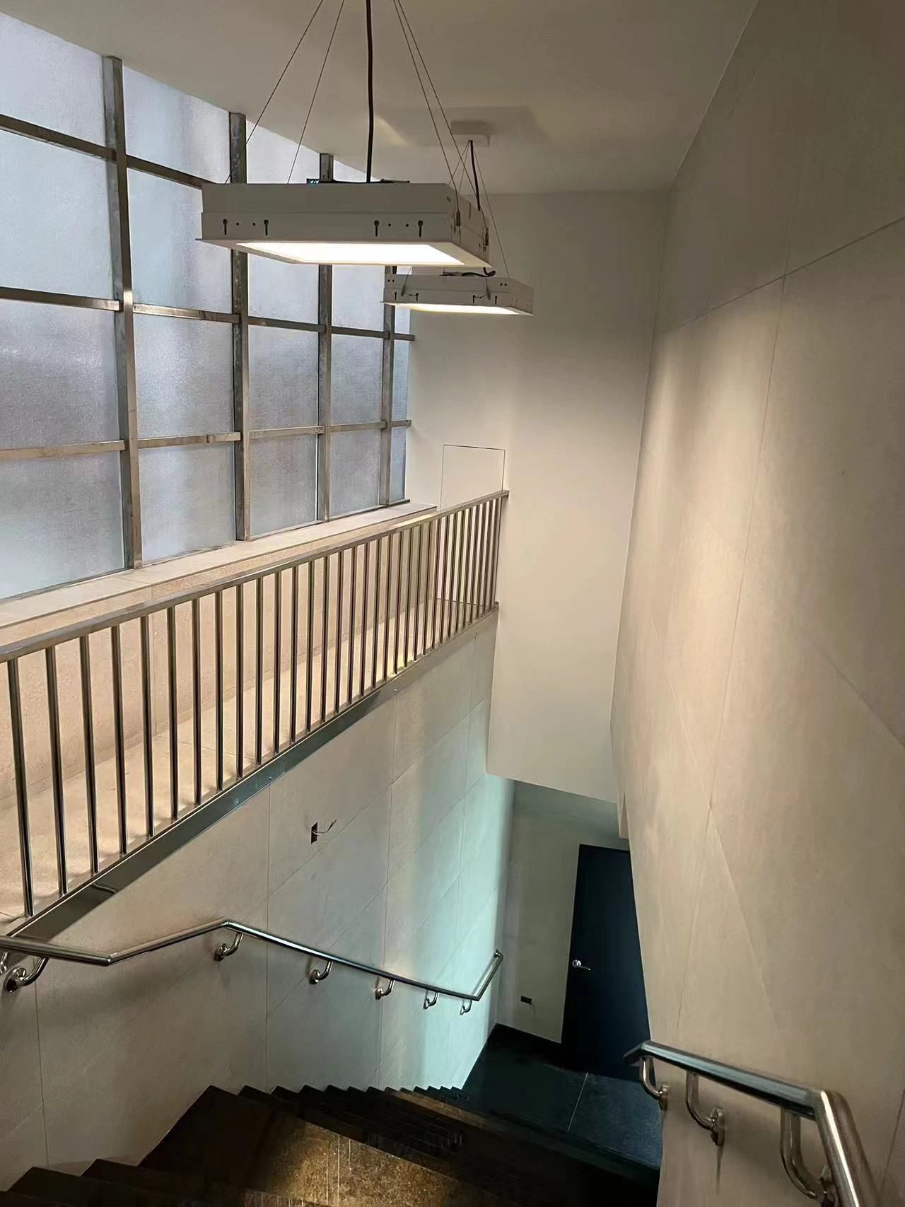 Two blue sky 0606 suspended skylights above a maternity hospital stairwell, brightening a windowless circulation space for safety and a more pleasant transition between floors.