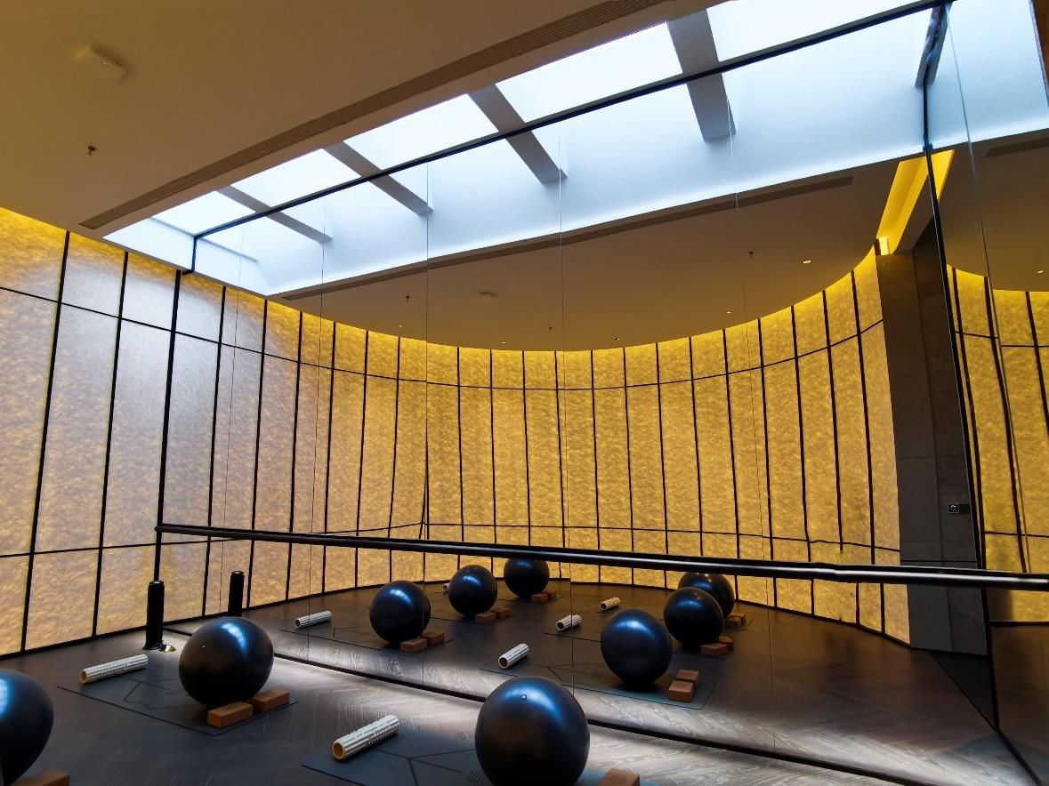 Row of blue sky artificial skylights in a fitness facility