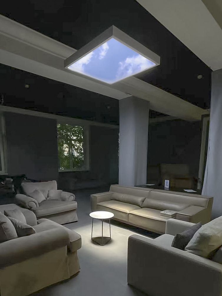 Suspended dynamic sky artificial skylight in an open plan living area