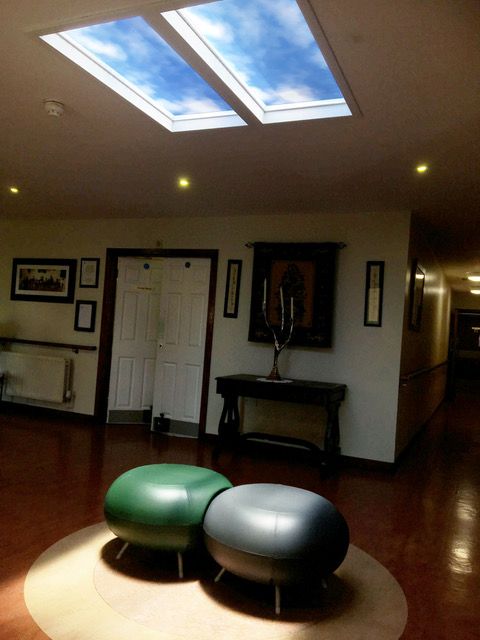 Pair of 1200x600mm artificial skylights above the same retirement village entry foyer, set to daylight 10,000K lighting to create a bright, welcoming impression during the day.