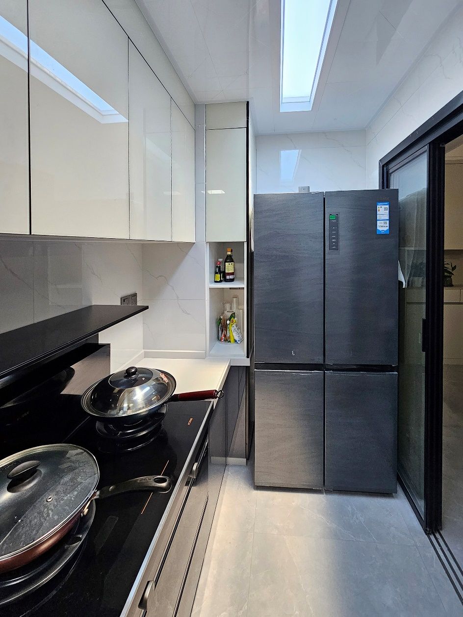 Slim 1500x300mm blue sky artificial skylight in a narrow kitchen