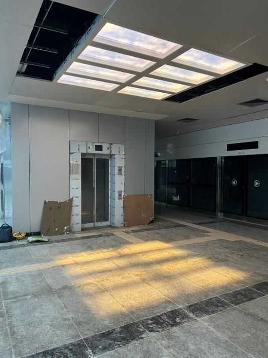 Grid of artificial skylights in a transit station upgrade