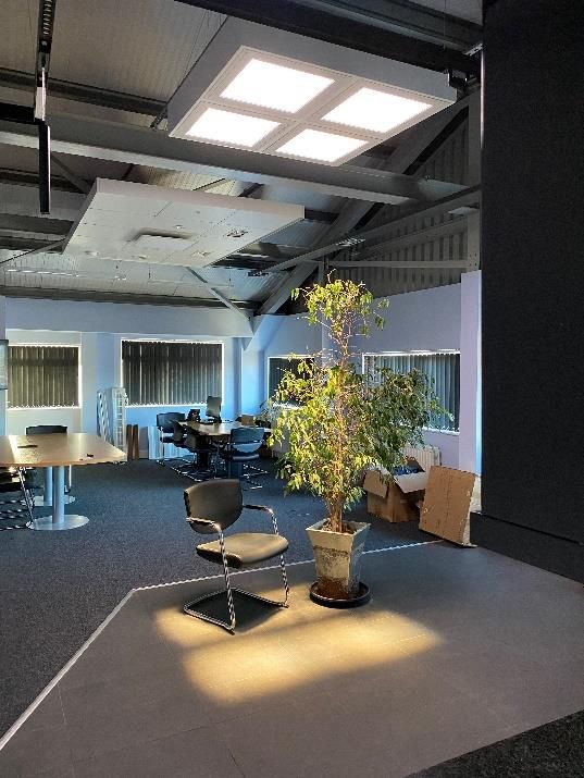 Blue sky 600x600 skylights installed in a custom suspended pendant above meeting area