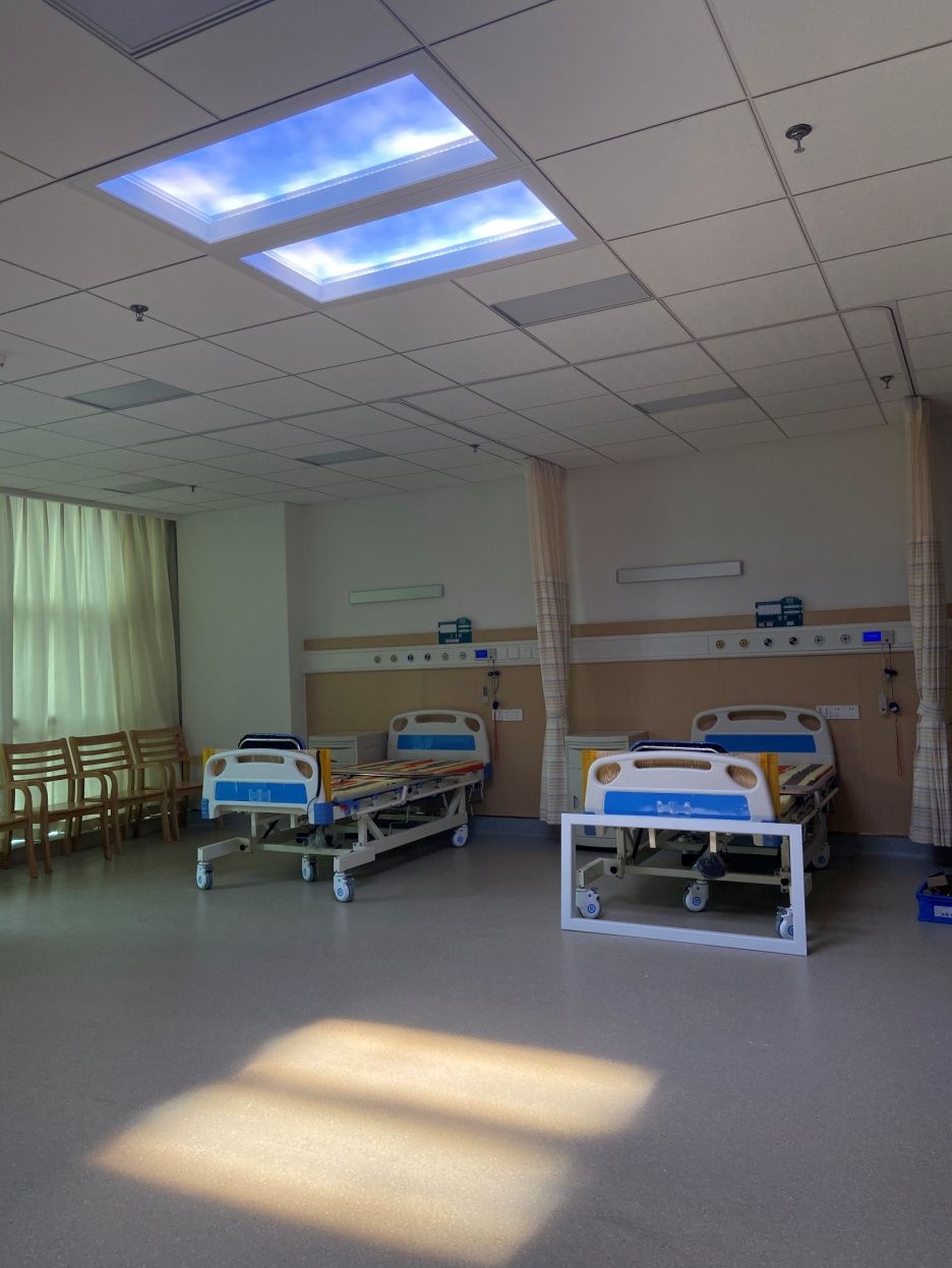 Dynamic sky artificial skylight above a hospital ward