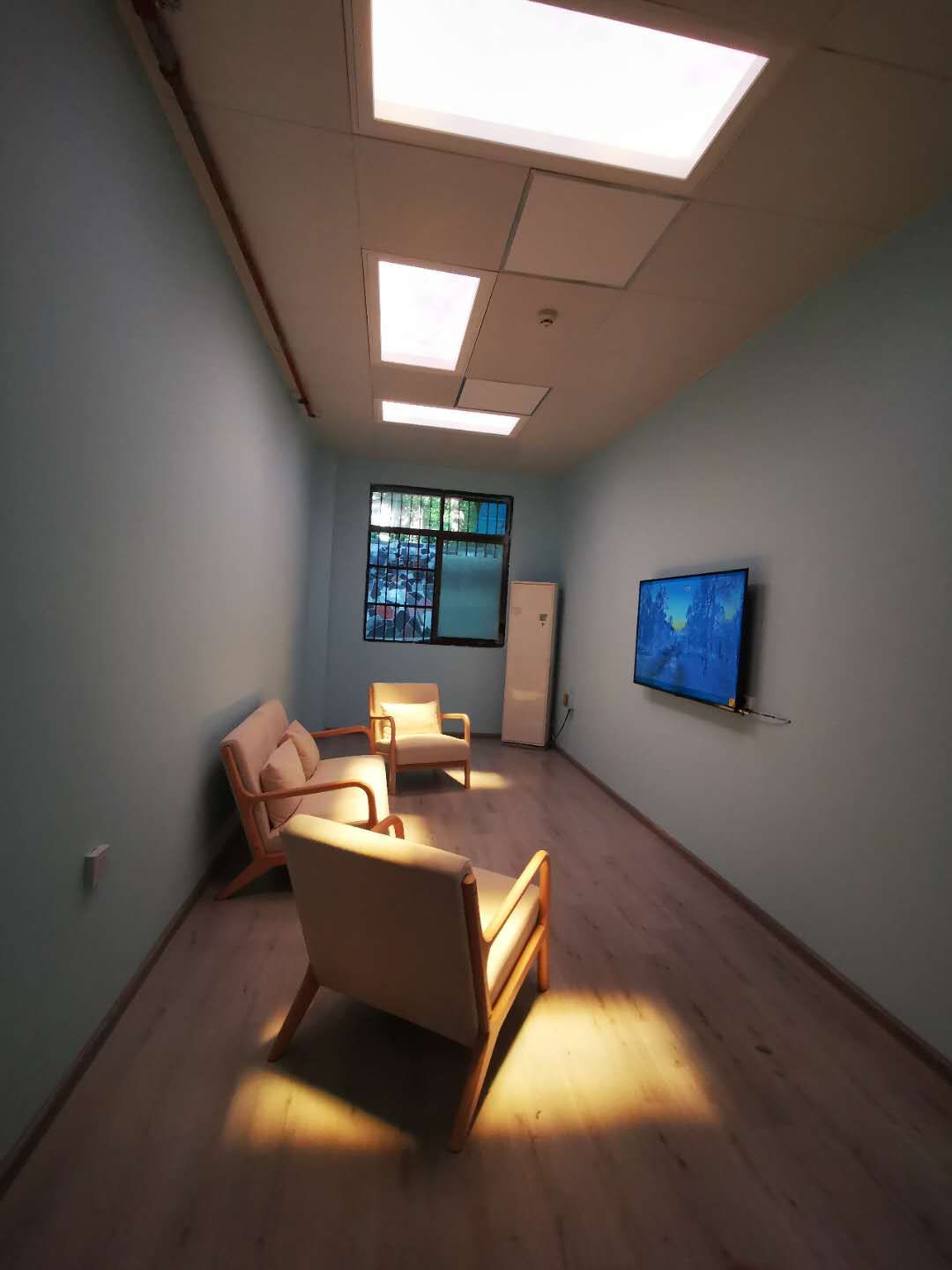 Second angle of the same psychiatry department therapy room with static clouds set to full warm white.